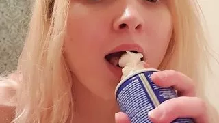 Cute girl gets crazy with whipped cream