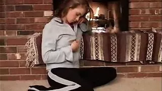 Little April with natural tits fingering beside fire place