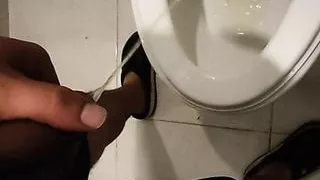 Bear pisses and strokes in the bathroom