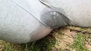 Pissing in pants outdoors