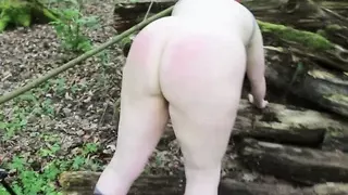 Ass spanking in the woods while bent over