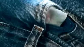 Young man ejaculating in jeans