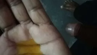 The Asian black boy massages his black dick