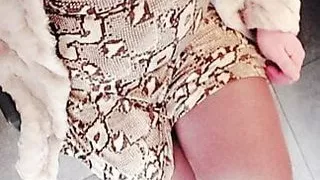 Crossdresser in fur and high heel boots