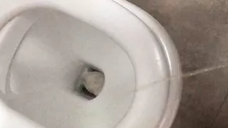Pissing in a public bathroom