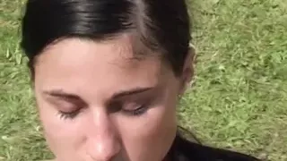 Sensual brunette gets screwed lying on the lawn