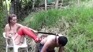 Latina dominatrix choking her slave