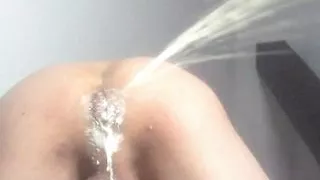 Pushing out a milk enema. Asshole