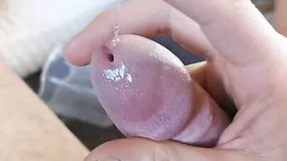 Masturbating on couch and cumming in a cup