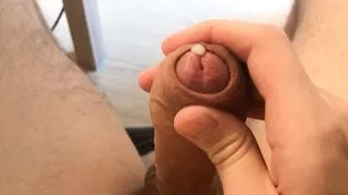 Cute guy jerks off big uncut cock and moans from edging
