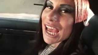 Stripteasing busty babe gets her tits out