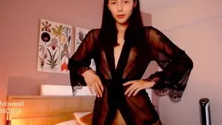 Sexy Colombian with a model's tattooed body seduces you in her semi-transparent black robe