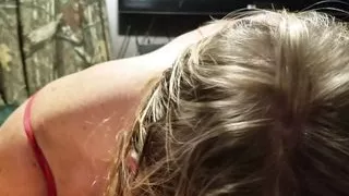 Blonde sucking cock while using a vibrator