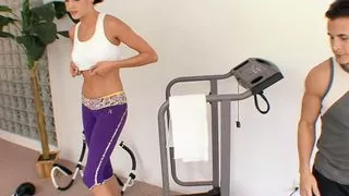Buff guy licks and fucks sexy slut's tight pussy next to exercise equipment