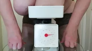 Granny Sally trying to weigh her huge saggy tits