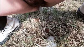 Farmer's Wife Wearing Boots Pees Twice in the Garden