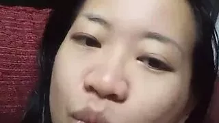 Asian girl is bored at home alone