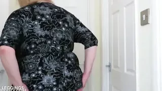 Sally wearing black leggings and low cut top