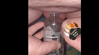 Chub pees in bottle with a hollow sound in his tiny cock and then plays with it a little.