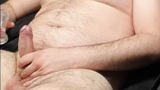 Bear wanking his uncut cock with some toys
