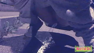 Girl alone at night in a parking lot lowers her pants in public to piss