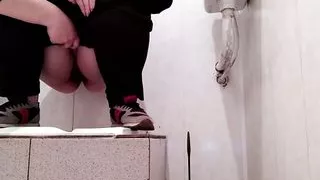 Hot milf pissing in public toilet