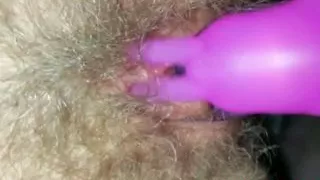 I'm caressing my pussy with a pink vibrator