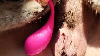 hairy wet butterfly pussy tests her new toy and pisses on the balcony with lust