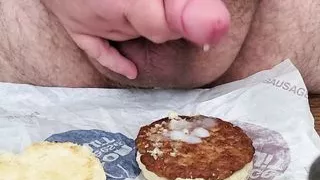 Adding some gravy to my sausage and biscuit