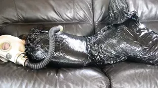 Plastic bondage - girl in gas mask