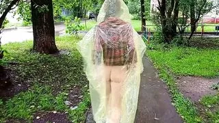 Girl in a raincoat flashing tits and ass on the city streets