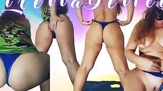 Mirella Delicia naughty bitch showing off with a little green dress and blue panties on the bed doing striptease