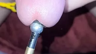 A Sounded estim session with a super close-up cumshot