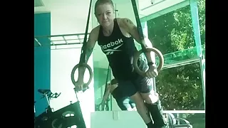 Mature redhead shows off her muscles