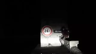 ass plugged on a bridge by night