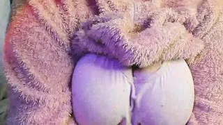 a fat woman in a fluffy suit shows her body