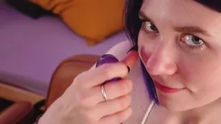 Purple hair girl sensually sucking and kissing dildo