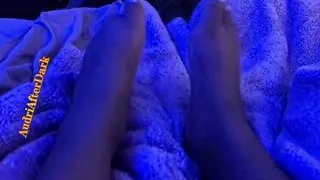 Ebony teen shows size 10 feet under blue light