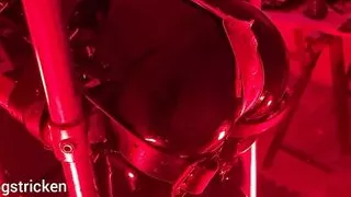 Rubber Gimp in latex with electro getting spanked