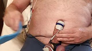 Elvis enjoys an estim hands-free orgasm while zapping his nipples and bound cock and balls... and beating his balls.