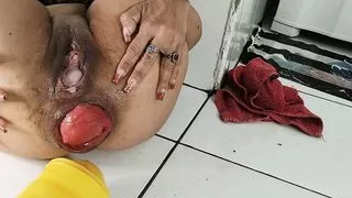 Maria Caldas takes a gigantic yellow dildo in her ass