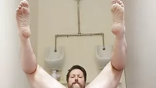 Naked wanking in a public restroom licking a urinal
