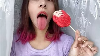 Naughty stepsister sucks a lollipop and shows her long hot sexy tongue