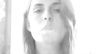 Busty Ashlee Graham smokes while showing off her natural tits