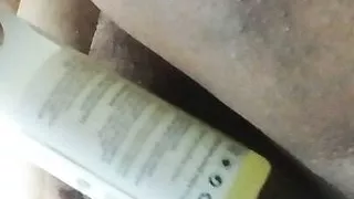 Bhabhi slapping hairy pussy and trying to enter oil bottle