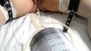 Wine enema and vaginal fisting