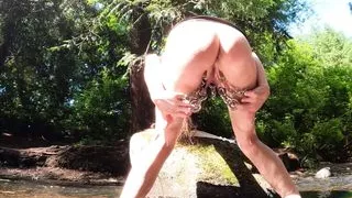 Long Pussy on the Creek. Piercings and Posing on a nice Day.