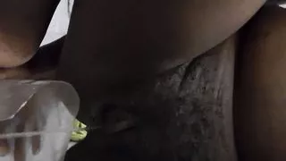 filling the cup with pee from my pussy