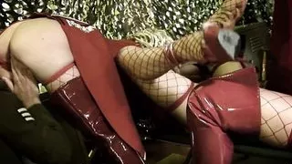 Bisexual women playing with a dildo engage in group sex with other soldiers