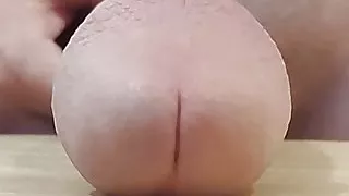 Slapping huge cock on table in slow motion